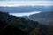 Early morning haze over a water reservoir and forest. Silvan Reservoir shot from Olinda in the Dandenong Rangers outside of Melbou