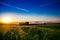 early morning. Juicy green meadow. Cereal fields