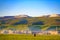 Early in the morning, a male herdsman walks on the grassland, Qinghai province, China