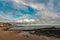 Early morning at Margate beach and tidal swimming pool, Kent with blue cloudy sky