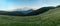 Early morning in mountain pasture at summer. Nature panoramic landscape. Carpathians mountains in august, west Ukraine