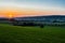 early morning with a sky full of beautiful colors during sunrise in the rolling hills landscape of Limburg