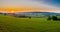 early morning with a sky full of beautiful colors during sunrise in the rolling hills landscape of Limburg