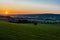 early morning with a sky full of beautiful colors during sunrise in the rolling hills landscape of Limburg