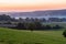 early morning with a sky full of beautiful colors during sunrise in the rolling hills landscape of Limburg