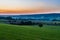 early morning with a sky full of beautiful colors during sunrise in the rolling hills landscape of Limburg