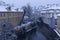Early Morning snowy historical Prague Mill above gutter Certovka, Czech republic