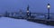 Early Morning snowy Prague Lesser Town with gothic Castle, Bridge Tower and St. Nicholas\' Cathedral from Charles Bridge