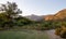 Early morning sunlight filters up a valley