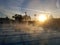 Early morning sunrise above steamy pool