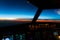 Early morning sunrise - captains view in the flight deck of a modern airliner airplane