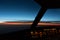 Early morning sunrise - captains view in the flight deck of a modern airliner airplane