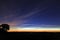 Early morning sunrise glow reflected in wispy clouds