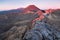 Early morning sunrise, landscape scenery of blue lake, wild mountains and huge volcano, autumn colours and golden sun rays.