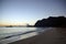 Early Morning Sunrise on Waimanalo Beach over Rock Island bursting through the clouds