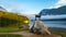 Early morning view at Lake Bohinj in Bohinj with the statue of Goldhorn (Zlatorog) on the rock, Bohinj, Slovenia.