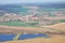 Early spring landscape with brown fields and solar power plant