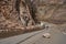 Early spring in the mountains. The rocks fell on the road. Dangerous bugle road. Rockfall in the mountains