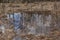 Early spring. Reflection of trees in the water at the edge of the forest