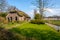 Early spring view on Giethoorn, Netherlands, a traditional Dutch village with canals and rustic thatched roof farm house