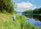 In the early summer morning, a fisherman is fishing in the upper reaches of the Volga River