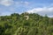 Early summer view across fields to hilltop Penne d`Agenais