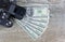 Earn money in internet DSLR camera, dollars, laptop, on wooden background