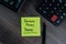 Earnest Money Deposit write on sticky notes isolated on office desk