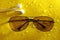 earphone sunglasses from sun water drop on abstract yellow background. melodies of autumn.