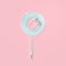 earphones blue pastel color wire lollipop shape on pink background