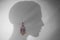 Earring fashion design idea, Head shadow silhouette with an earring.