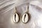 Earrings with sea shells in brass decorative oval