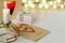 Earrings in the shape of hearts on a card says Forever. Candle in diamond shaped candlestick