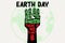 Earth Day environmental activism, raised hand with climate change and other environmental messages