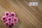 Earth Day Flowers composition of Pink Chrysanthemums spring concept on wood background flat lay