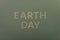 Earth Day green cardboard letters. green paper