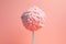Earth depicted as a lollipop on pink background