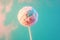 Earth depicted as a lollipop on pink background