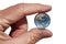 The Earth globe held between index finger and thumb. The earth pinced between two fingers. Evironmental concept. Close up image