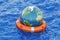 Earth globe with lifebuoy on the open sea. Save the world concept, 3D rendering