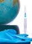 Earth globe and syringe. Medicine, healthcare and medicine, vaccination