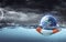 Earth On Lifebuoy In Storm Ocean