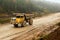 Earth mover loading dumper truck with sand in quarry. Excavator loading sand into dumper truck.Quarry for the extraction of minera