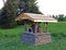 Earth Oven with Stone Foundation and Cedar Roof