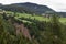 Earth pyramids in front of a scenic landscape of South Tyrol, Northern Italy