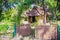 Earthen house under shade of trees. An earth house, also known as earth berm, earth sheltered home, or eco-house is an architectur