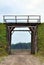 Earthen wall with a wooden gate in it