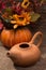 Earthenware teapot with a decorative pumpkin
