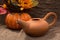 Earthenware teapot with a decorative pumpkin