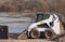 Earthmover on the protection dam under construction